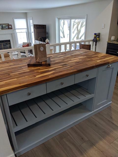 Custom kitchen island with overhang for seating. Kitchen cabinet storage. Handcrafted furniture. Made in USA. Made to order and custom built kitchen island. Heirloom quality furniture